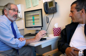 Dr. Peter Eisenberg, left, said people with less money were treated differently by doctors. Credit Preston Gannaway for The New York Times