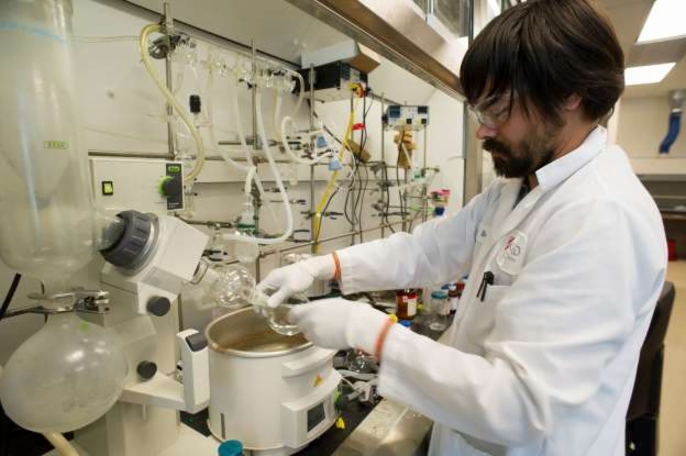 © David Paul Morris/Bloomberg A research scientist for Gilead Sciences Inc., works on the synthesis of a potential hepatitis C virus drug candidate at the company's lab in Foster City, California, Feb. 8, 2012.