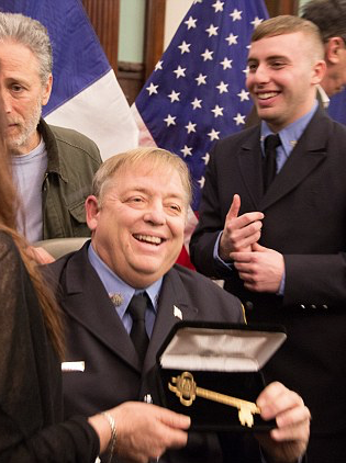 Hero: Firefighter Ray Pfeifer  with Jon Stewart, receiving the key to New York