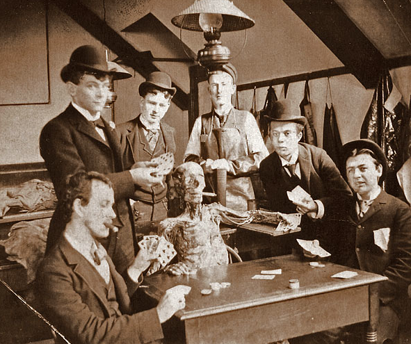 Medical students pose with a cadaver 1890