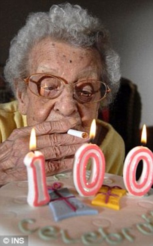 Smokers who live for a long time may have specific genes that promote a lengthy lifespan, scientists have found. Winnie Langley, who died aged 102, is pictured lighting a cigarette on her 100th birthday