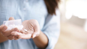 woman-taking-aspirin-8-ways-to-prevent-cancer-by-healthista